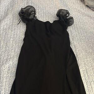 Elegant Black Dress with Sheer Puff Sleeves. Long formal stretchy material. Slit